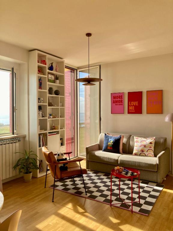 a living room with a couch and a table at Punta Penna Seahouse in Vasto