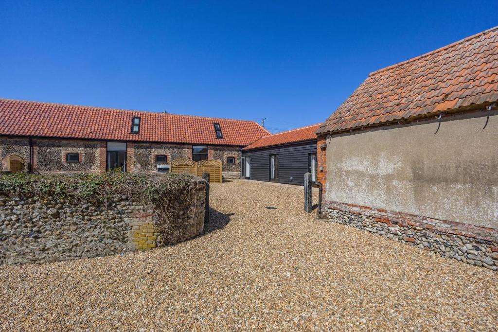 a courtyard of a building with a stone wall at 2 Bed in Barrow oc-b42642 in Barrow