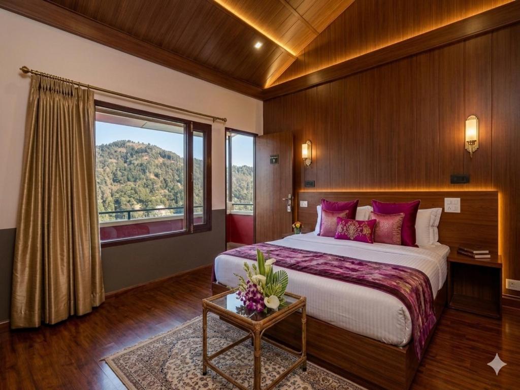 a bedroom with a large bed and a large window at Aurevelle Kastura Resort Kanatal - Mountain View Rooms in Kanatal