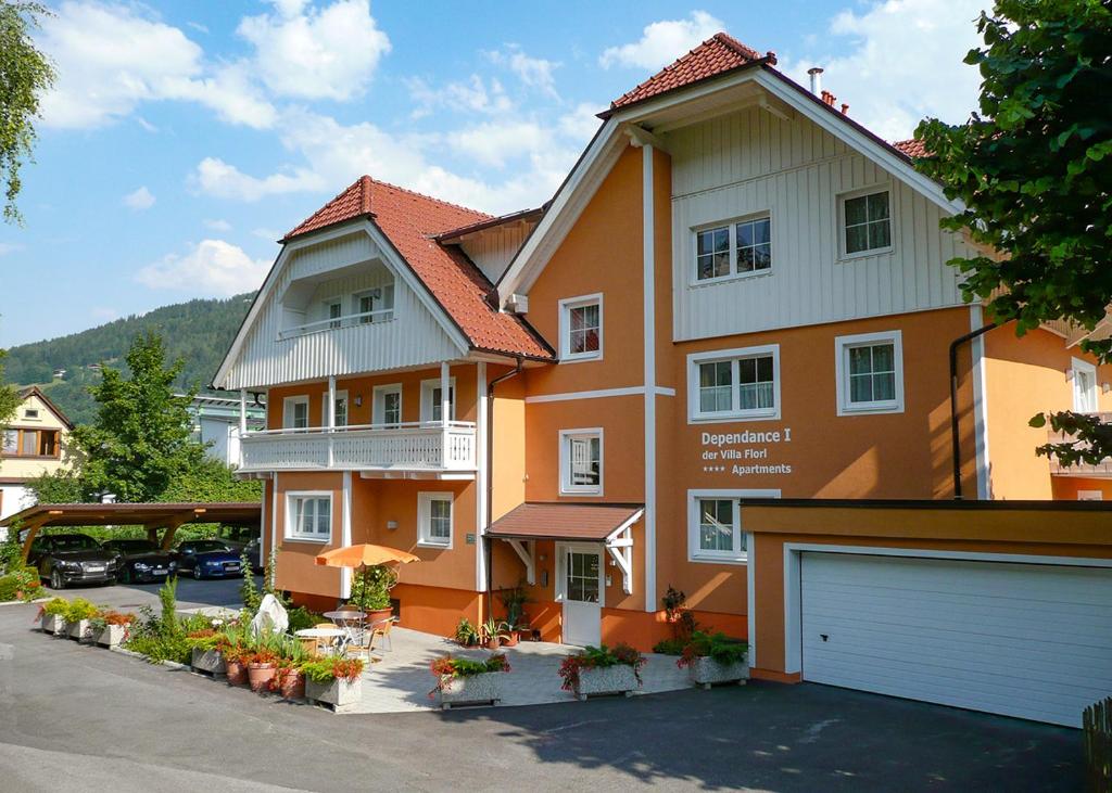 a large house with a garage in a parking lot at Dependance I in Schladming