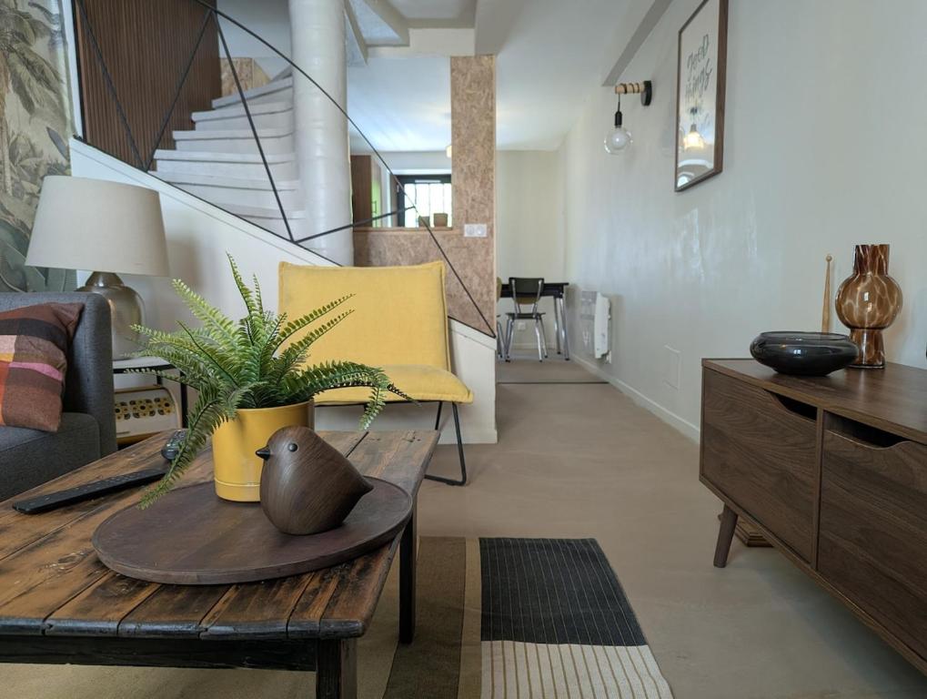 a living room with a couch and a table at Les Chapeliers in Foix