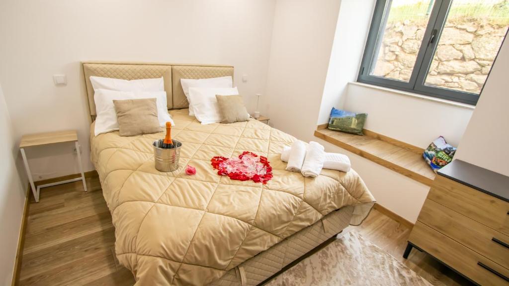 a bedroom with a large bed with a bed sidx sidx sidx at A Casa do Penedo - Arcos de Valdevez in Arcos de Valdevez