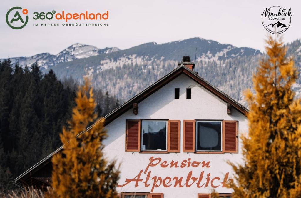 a house with a sign on the side of it at Alpenblick Gösweiner in Windischgarsten