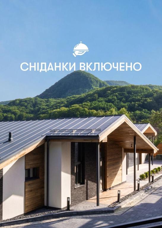 a house with solar panels on the roof at Apartel Villa Shayan in Shaian