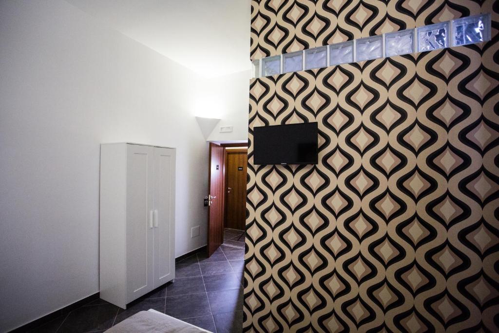 Televízia a/alebo spoločenská miestnosť v ubytovaní Casa Retro'