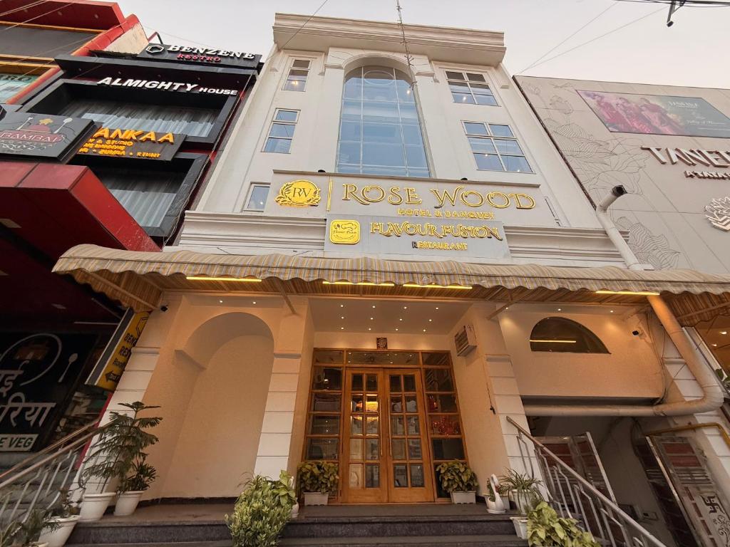 a building with the words lost wood on it at Hotel Rosewood in Prayagraj