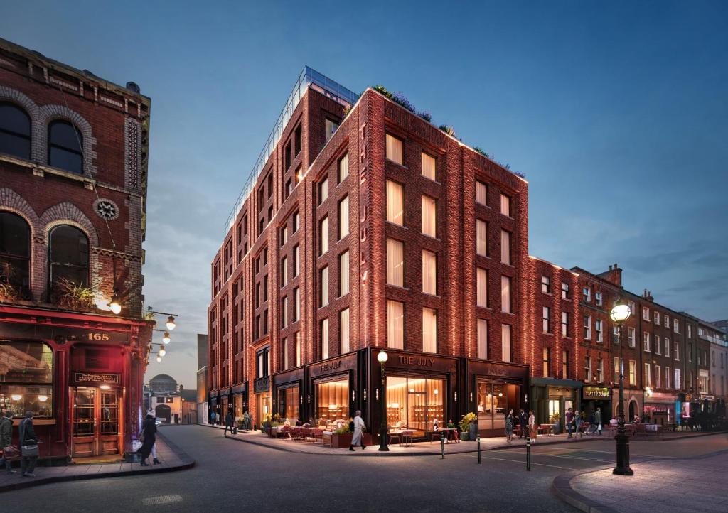 a large brick building on a city street at The July - Capel Street in Dublin