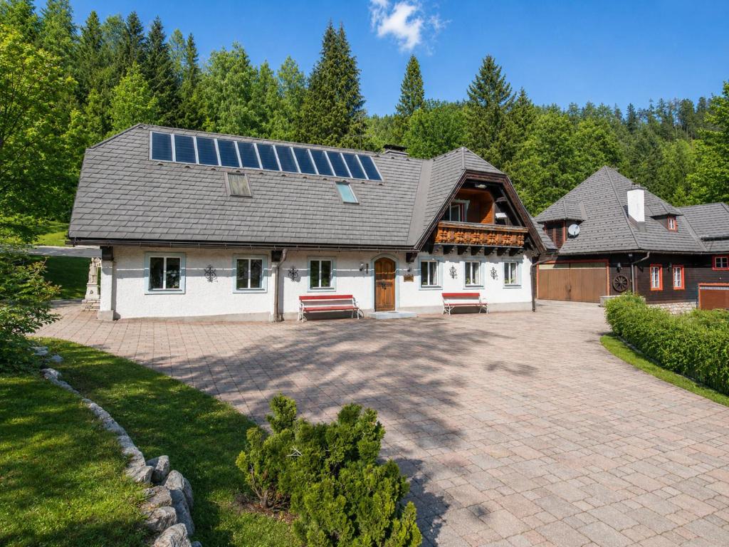 a house with solar panels on the roof at Erlaufsee Estate by Landluft in Mitterbach