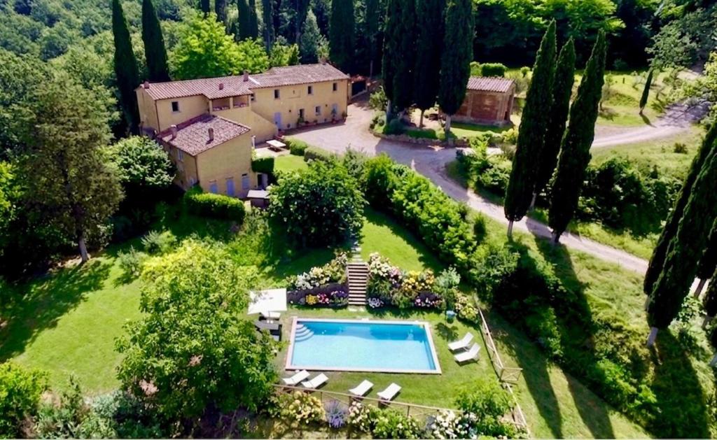 an aerial view of a house with a swimming pool at Villa Ginevra by Tenuta di Ghizzano in Ghizzano