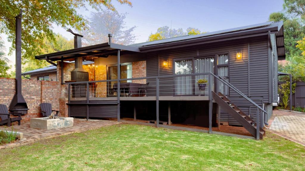 a contemporary house with a modern deck and yard at Fine Stay Clarens in Clarens
