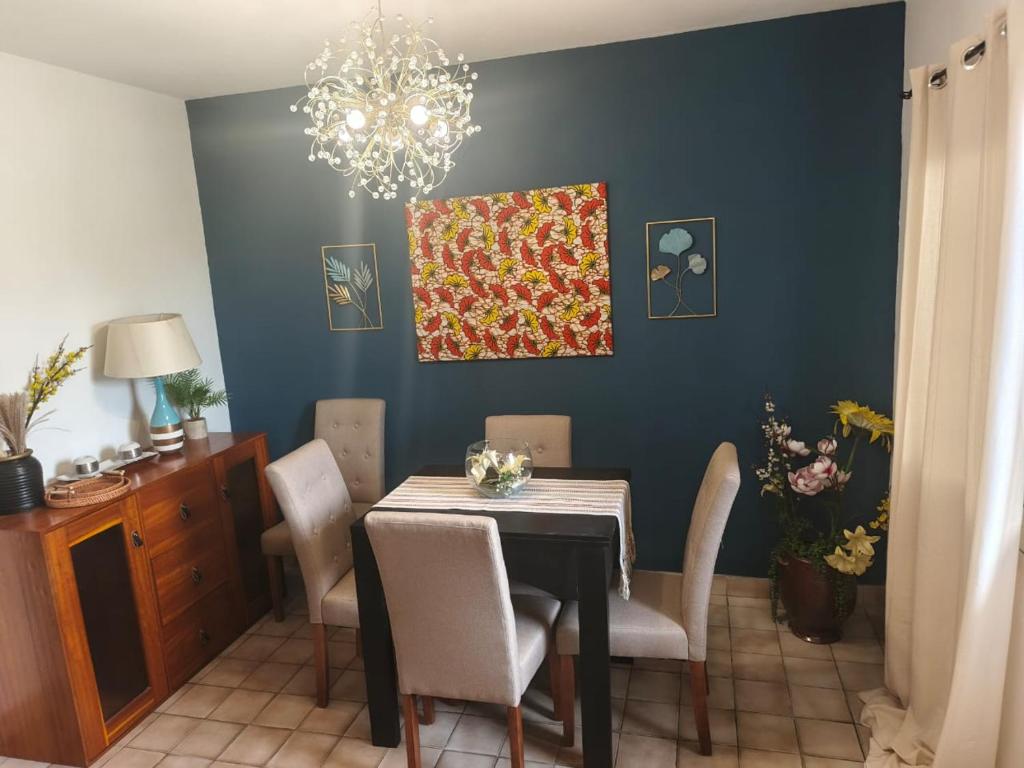 a dining room with a table and chairs at 'Belkaz in Port-Gentil