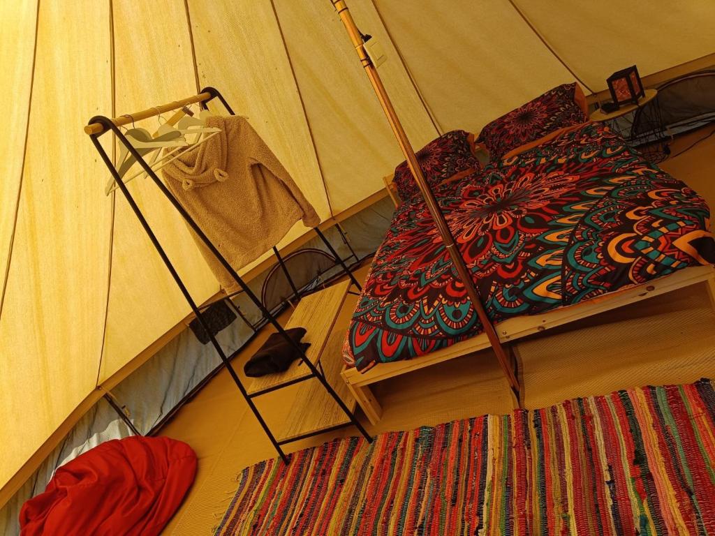 a room with a tent with a rug on the floor at El Astial De Ezquerra - Camp in Ezquerra