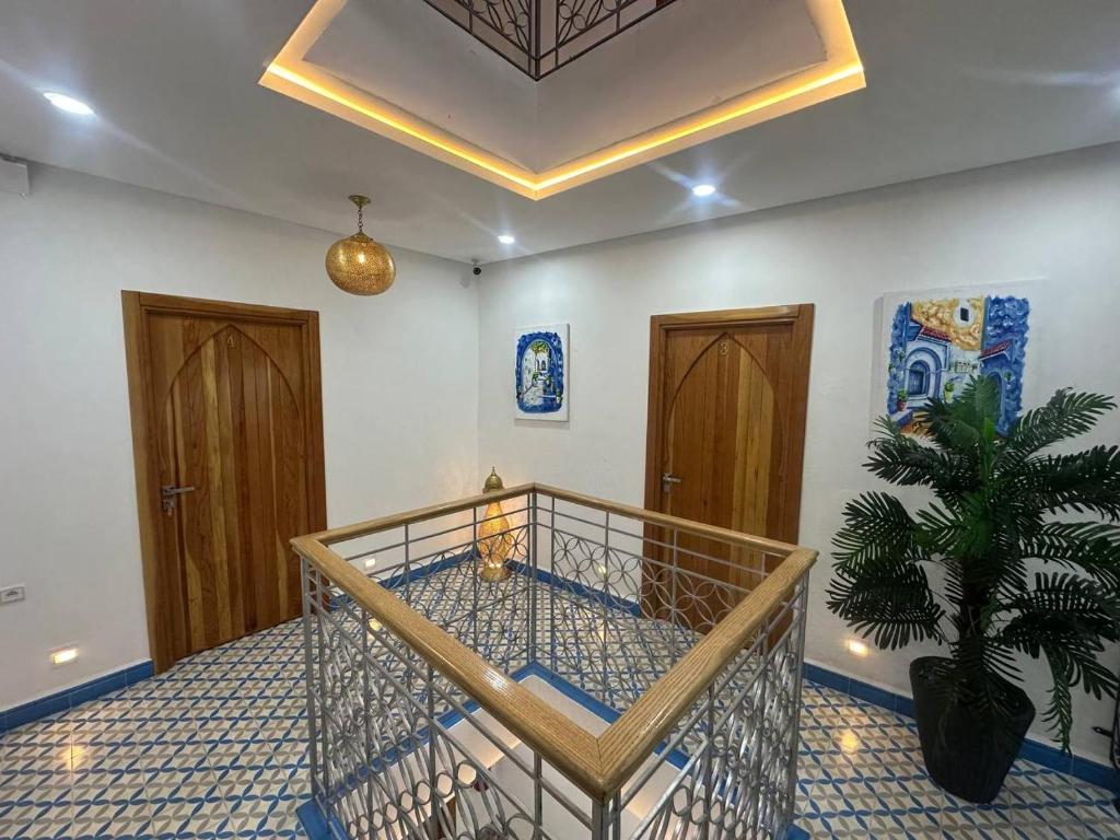 a room with a cage with a plant in it at Ahlan Riad Chefchaouen in Chefchaouen