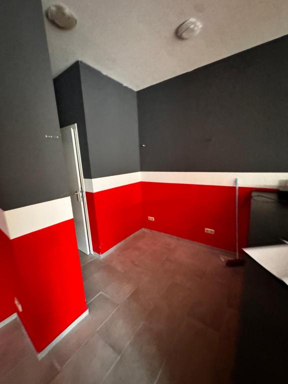 an empty room with red and black walls at Freilassing Unterkünfte in Freilassing