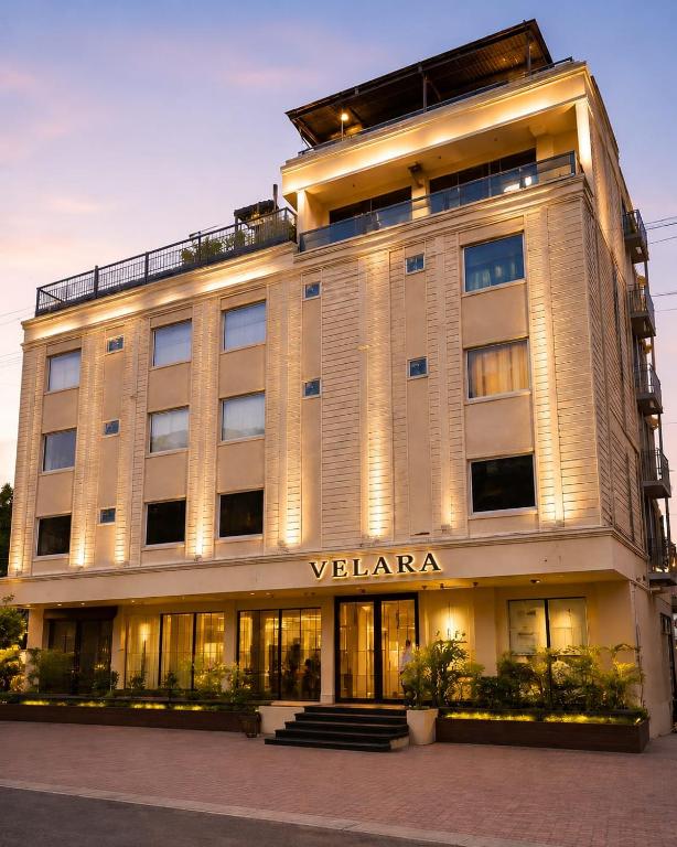 a building with a sign on the front of it at Velara Hotel & Banquet in Gwalior