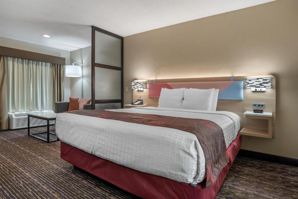 a hotel room with a large bed in a room at Best Western Vicksburg in Vicksburg