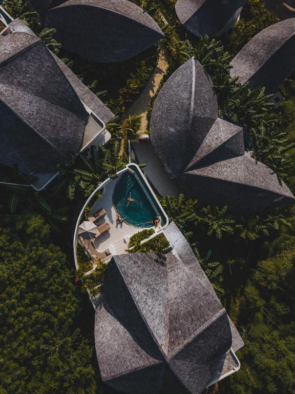 an overhead view of a building with a swimming pool at Mambo Lombok in Kuta Lombok