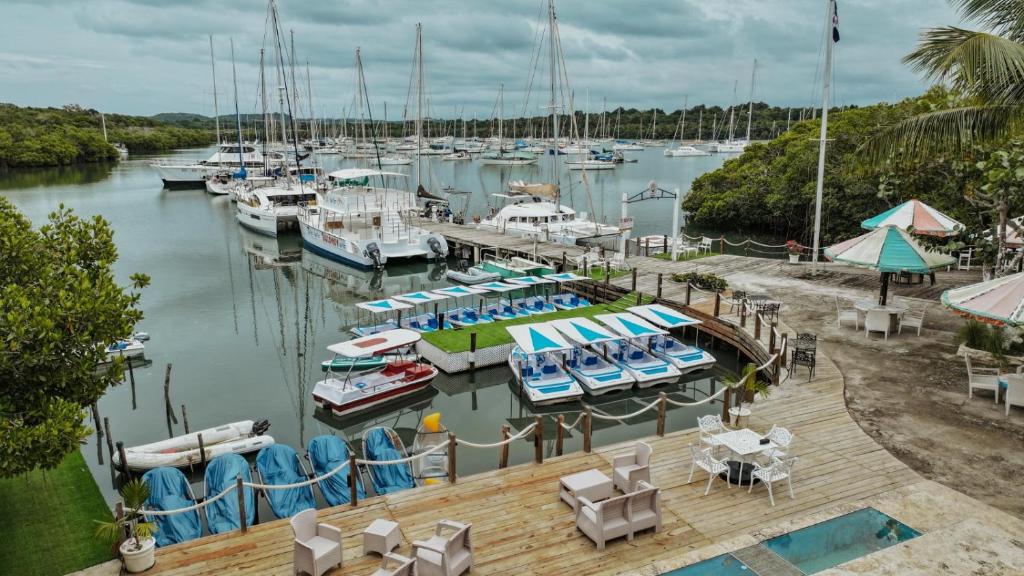 a marina with boats parked in the water at Puerto Blanco Marina & Hotel in Puerto de Luperon