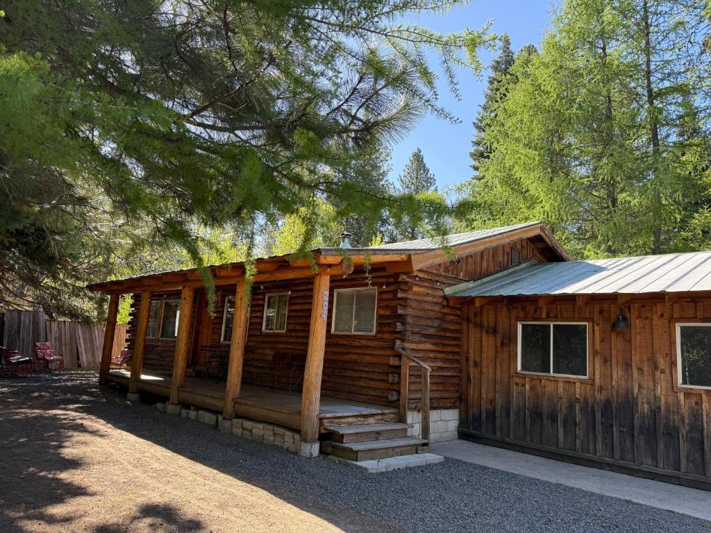 a log cabin with a porch and stairs to it at Miller Cabin in McCall