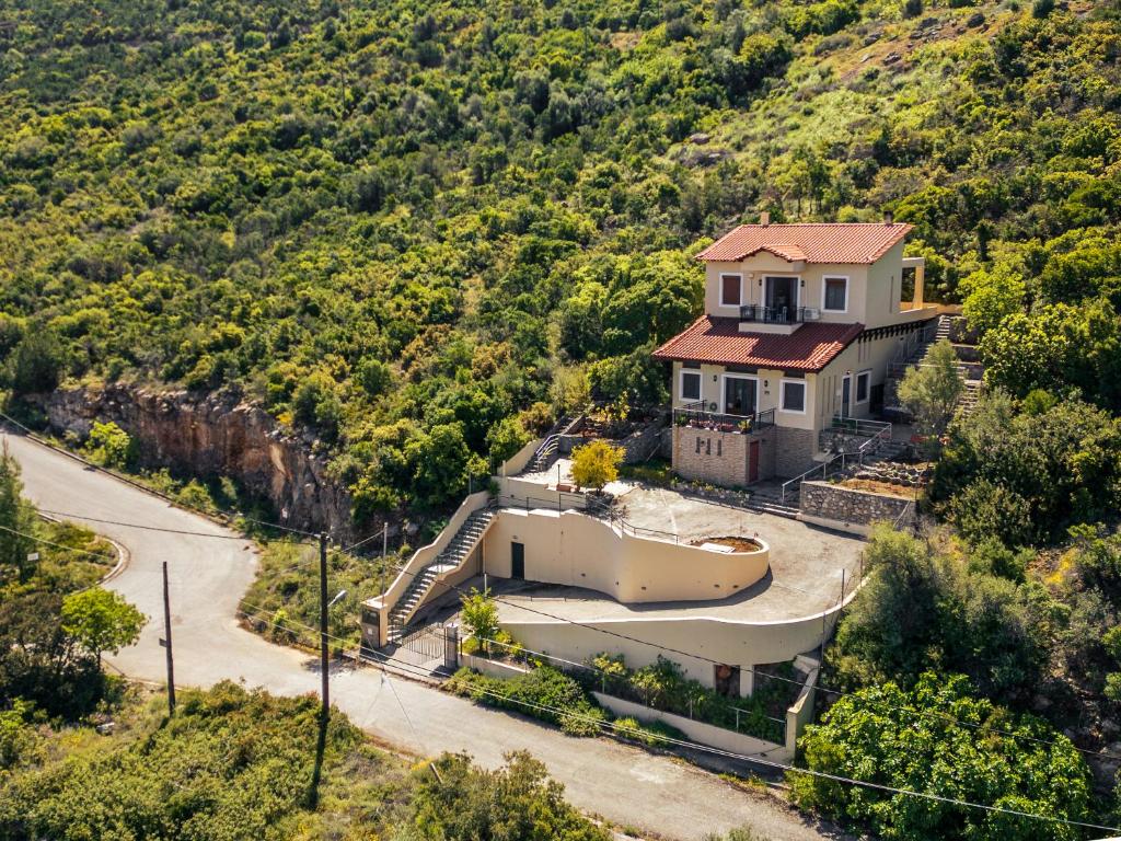a house on the side of a hill at Heritage Ridge in Skroponeria