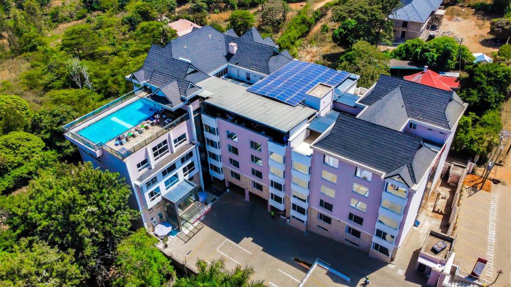 an overhead view of a large building with a swimming pool at Ngolu Hotel and Residences in Kitui
