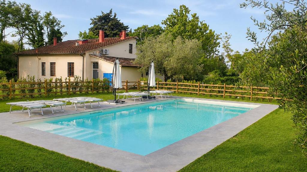 a swimming pool in the yard of a house at Il Sottolo in Florence