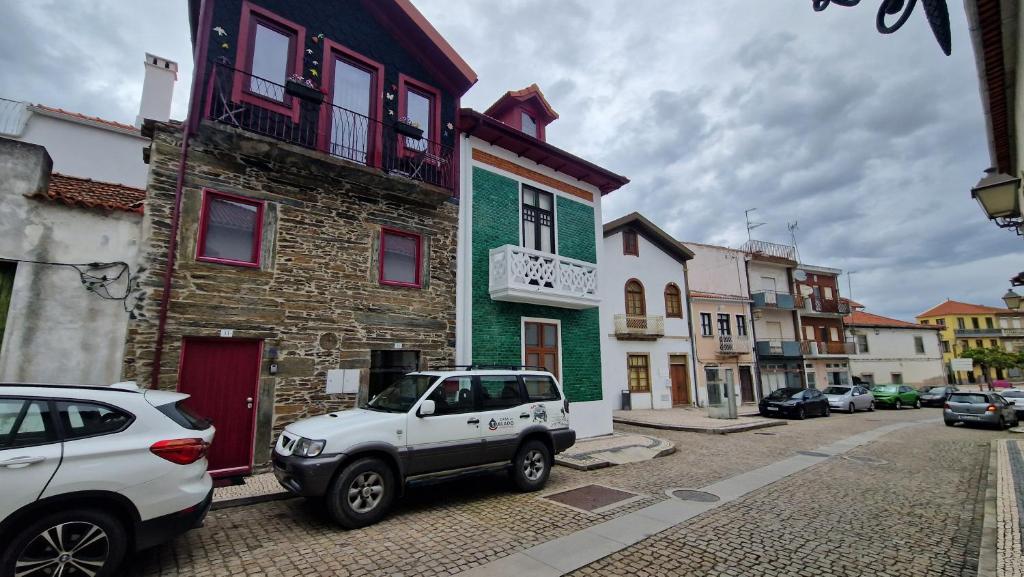 a white car parked in front of a building at Casa do Tablado - Foz Côa in Vila Nova de Foz Coa