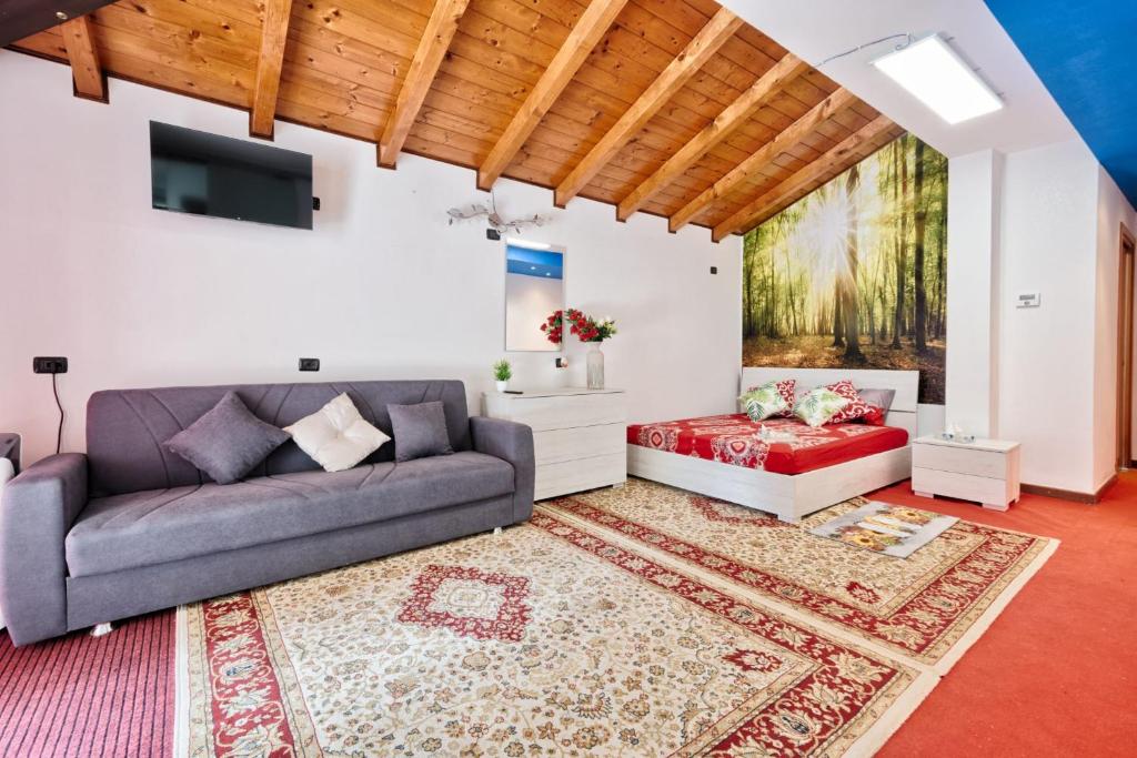 a living room with a couch and a table at Jolly Private Room in Marghera