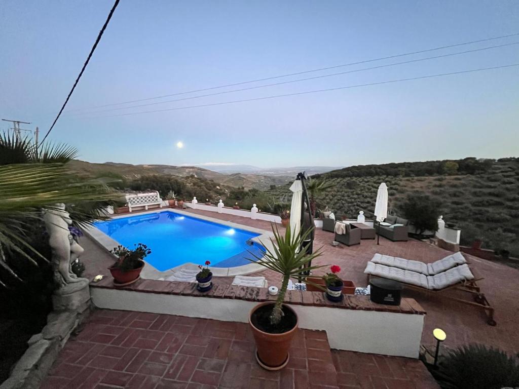 a view of a swimming pool in a backyard at Casa Araflo in Cortijada Los Chorreros
