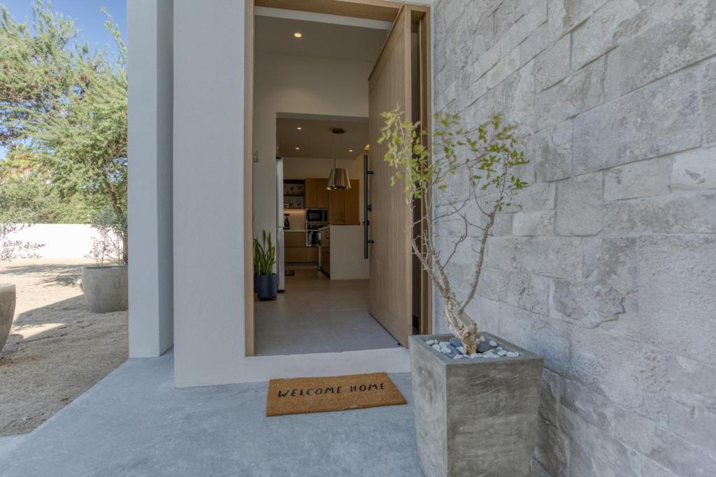 a hallway of a house with a plant in a vase at Luxury Villa With Pool in Los Barriles
