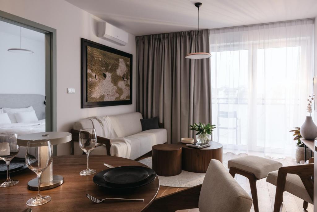 a living room with a couch and a table at Nowy Sącz Apartamenty in Nowy Sącz