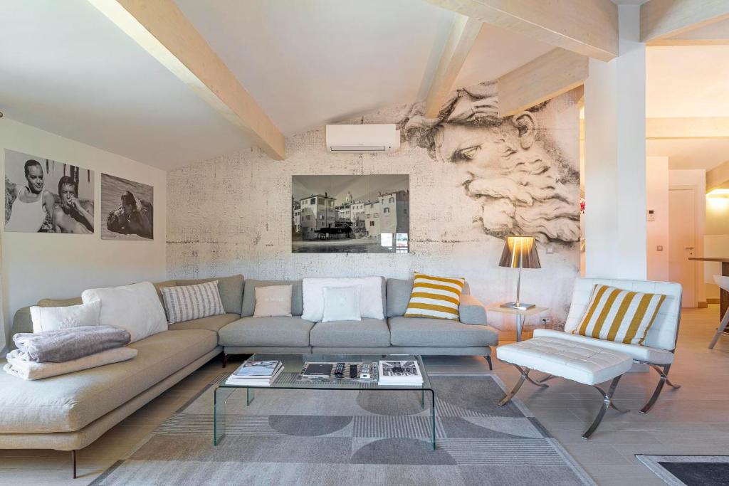 a living room with a couch and a table at Appartement DELICE A in Saint-Tropez