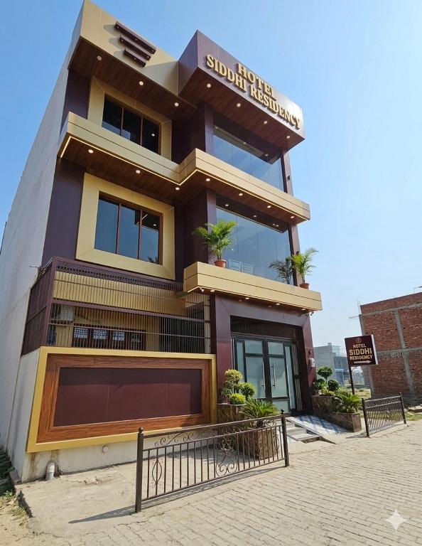 a building with a sign on top of it at The Hotel Siddhi Residency near Ram Mandir in Ayodhya