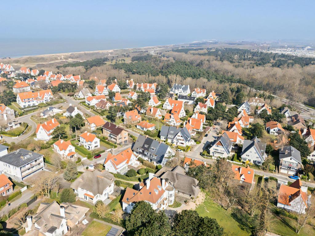 an aerial view of a town with orange roofs at Summer Dream in De Haan