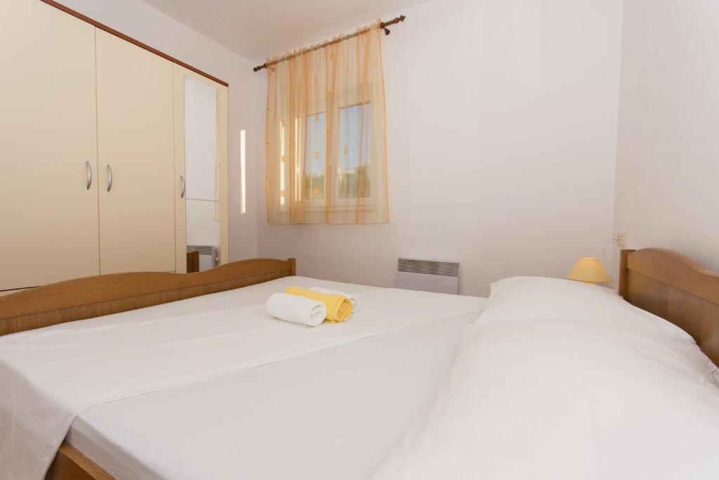 Postel nebo postele na pokoji v ubytování Apartmani Gaube