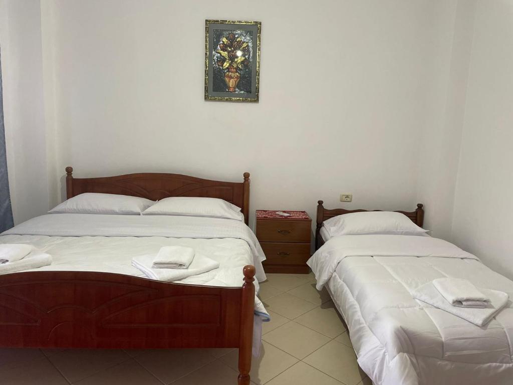 two beds sitting next to each other in a room at Olive Nest Bunec in Sasaj