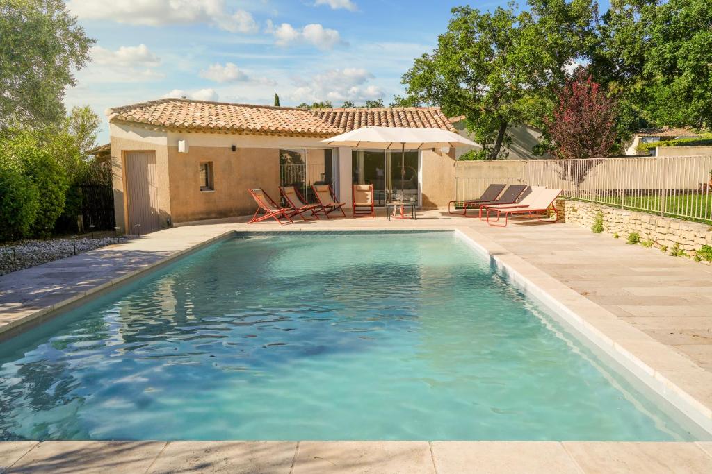 a swimming pool in front of a house at Casa Mamou in Cavaillon