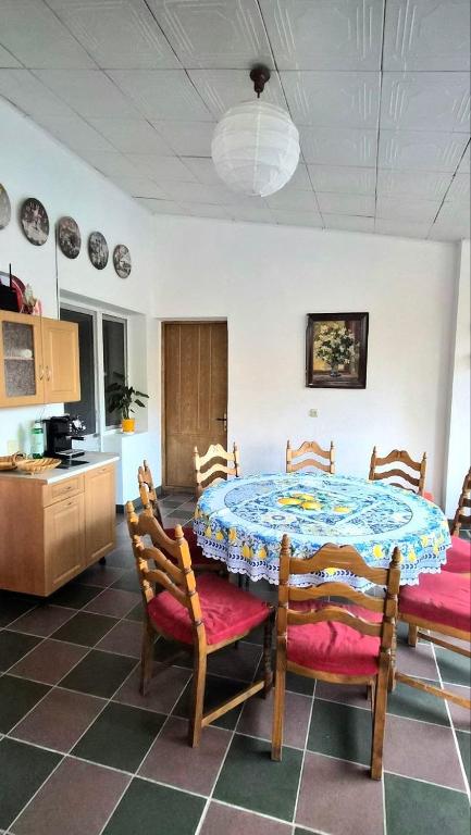 a kitchen with a table and chairs in a room at Таки Дача на Фонтане in Odesa
