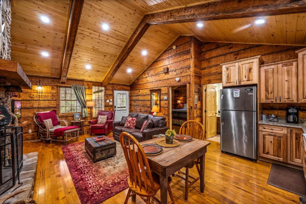 a kitchen and living room with a table and a refrigerator at Wildwood in Townsend