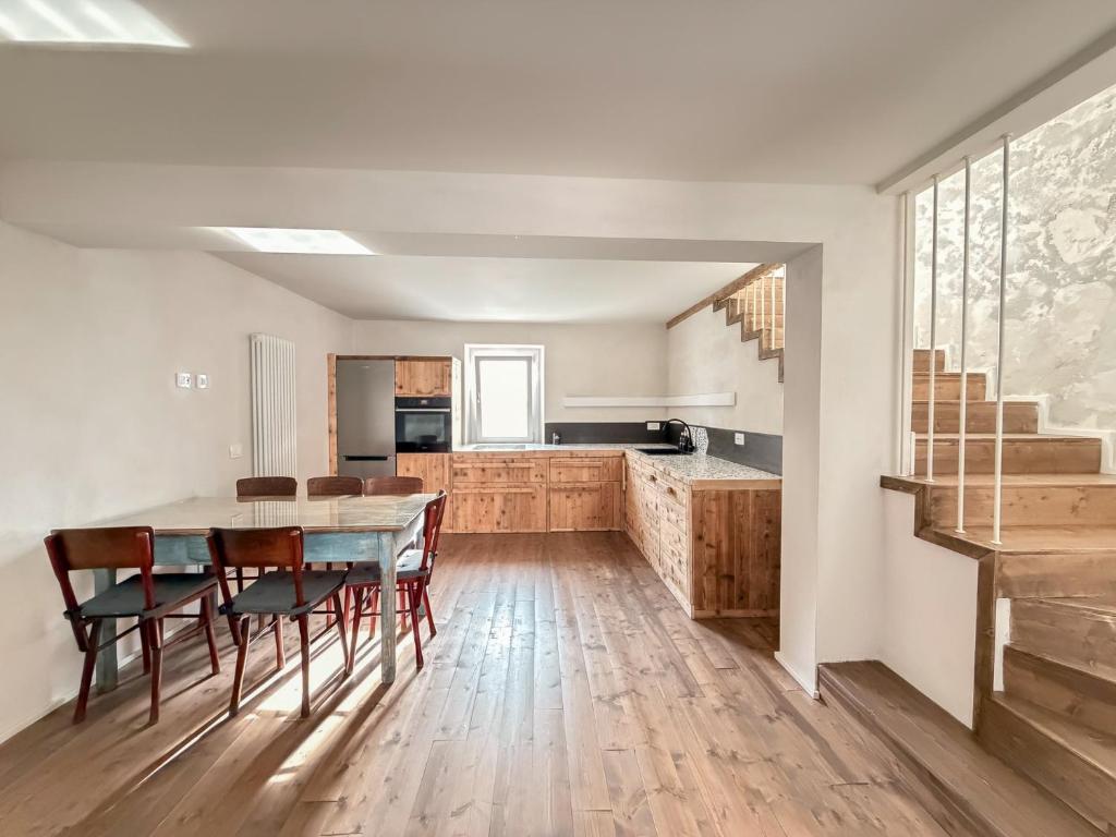 a kitchen and dining room with a table and chairs at Ancona design apartment in Ancona
