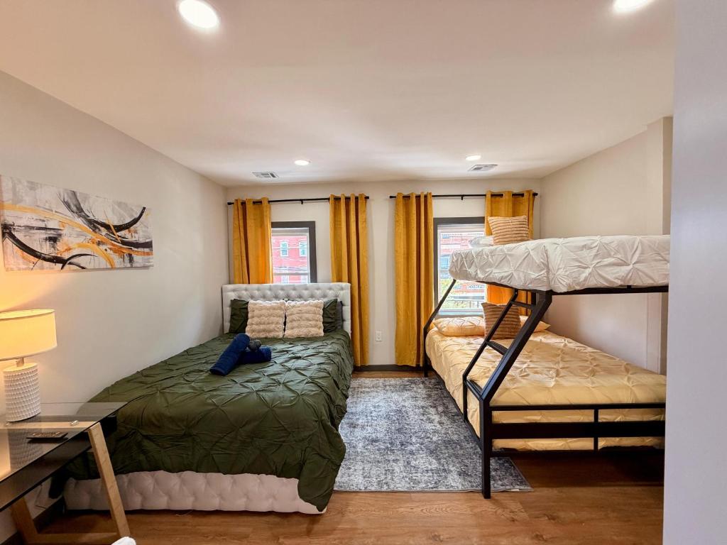 a bedroom with a bunk bed and a desk at BP STAYS - Hotel-Style, No Host, Professionally Managed ID312 in Jersey City