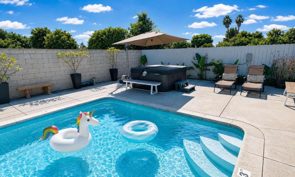 a swimming pool with a toy duck and a unicorn in it at Disneyland Retreat-Pool Spa Game in Anaheim