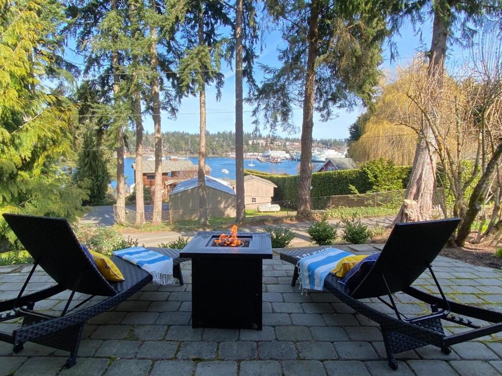 two chairs and a table on a patio at The Perch at Eagle Harbor in Bainbridge Island