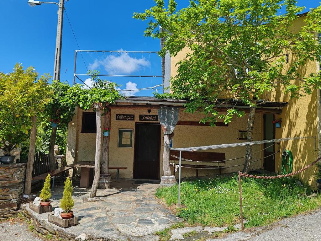 an outside view of a house with a porch at O Solpor Fillobal in Vilar