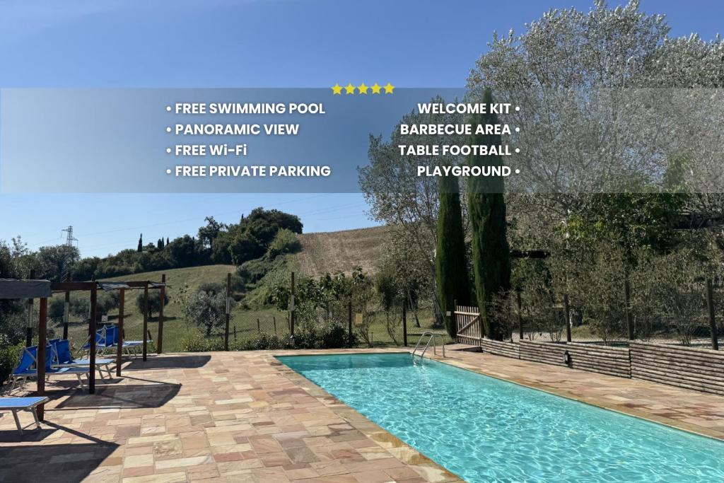a swimming pool in a villa with a view at Agriturismo Il Vecchio Scornabecco in Senigallia