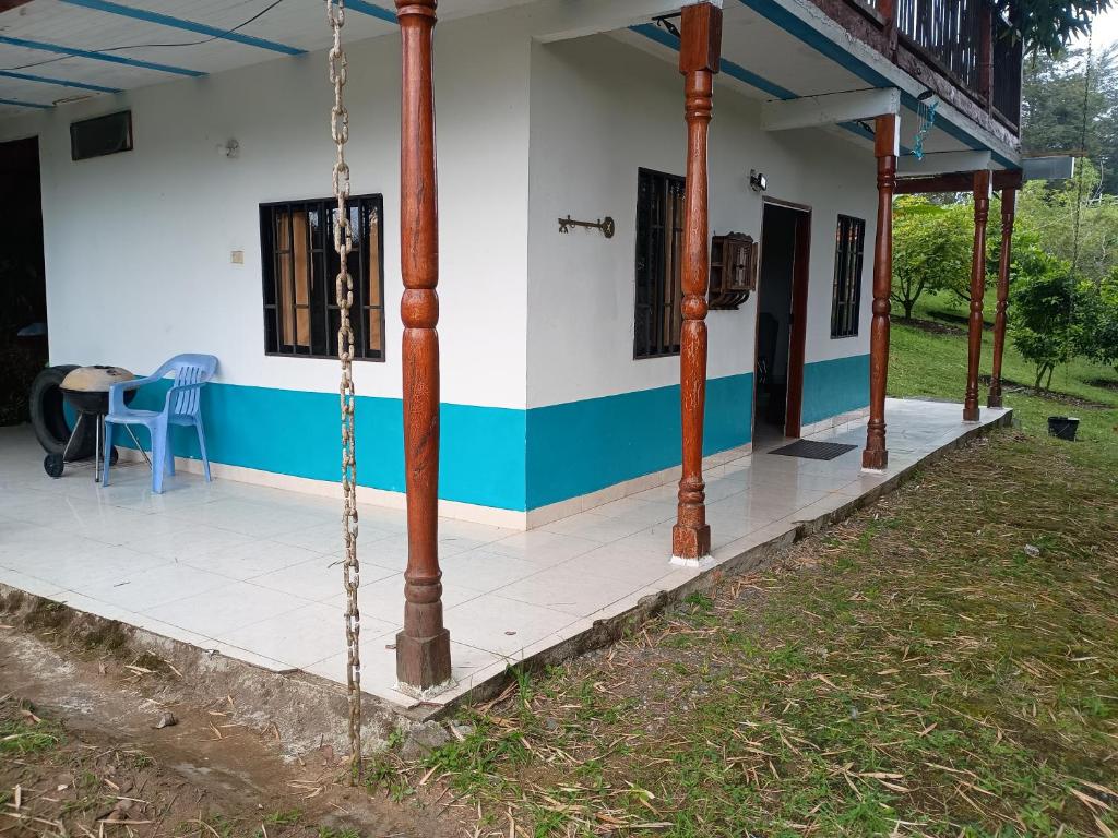 a house with a porch with a swing at PUEBlA in Marinilla