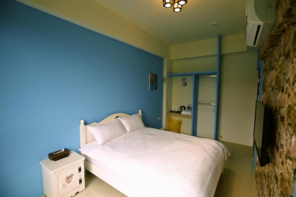 Postel nebo postele na pokoji v ubytování Feng-Tian Inn