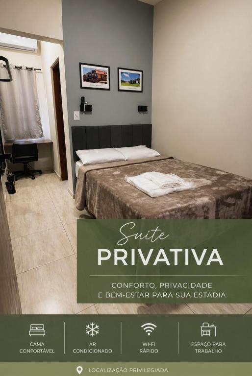 a hotel room with a bed and a sign that says sire pyrimivo at São Hostel in São Roque