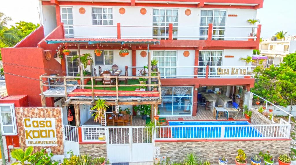 an apartment building with a balcony and a pool at Casa ka'an in Isla Mujeres