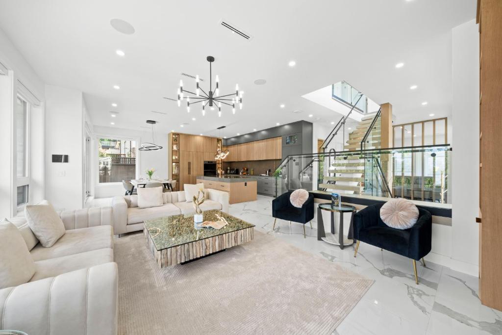 a living room with a couch and a table at North Shore Luxe Villa in North Vancouver